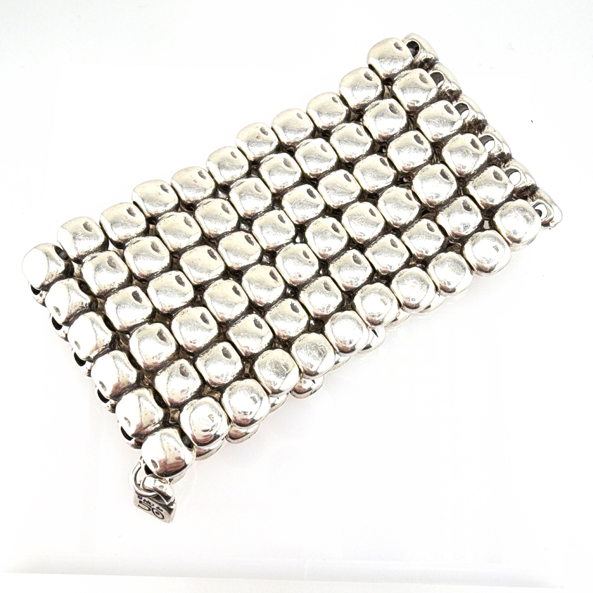 Uno de 50 Silver Tone Wide Stretch Cuff Bracelet, 170.18g 7-7.50in — Front