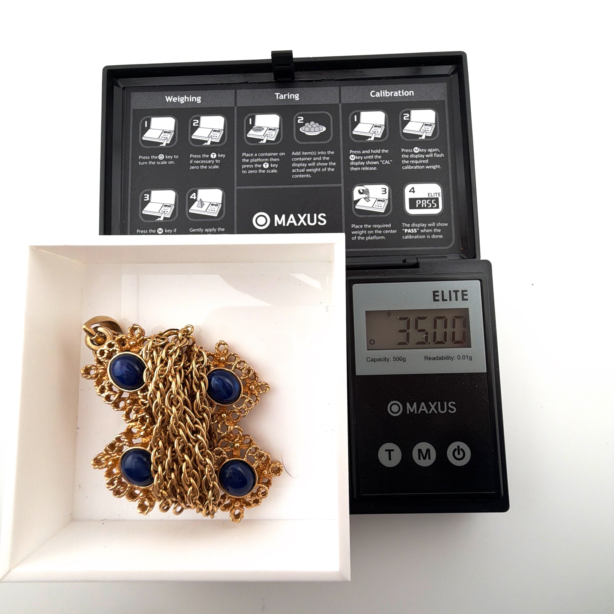 60s–70s Sarah Coventry Gold Tone Blue Cabochon Cross Pendant Necklace 35.00g 24 in — For scale
