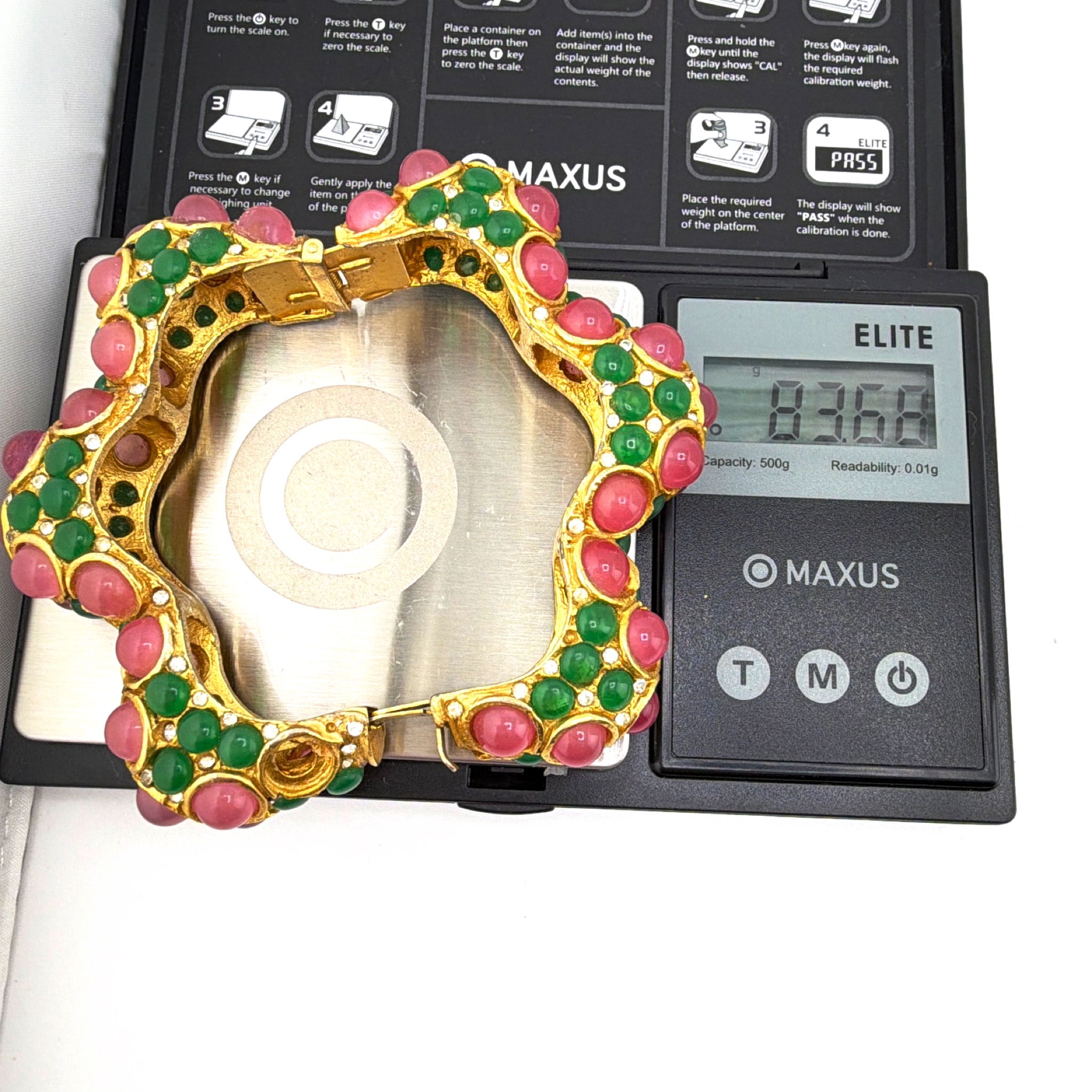 Retro 60s–80s K.J.L Gold Tone Pink Green Cabochon Bangle 83.68g 2.5 in — For scale