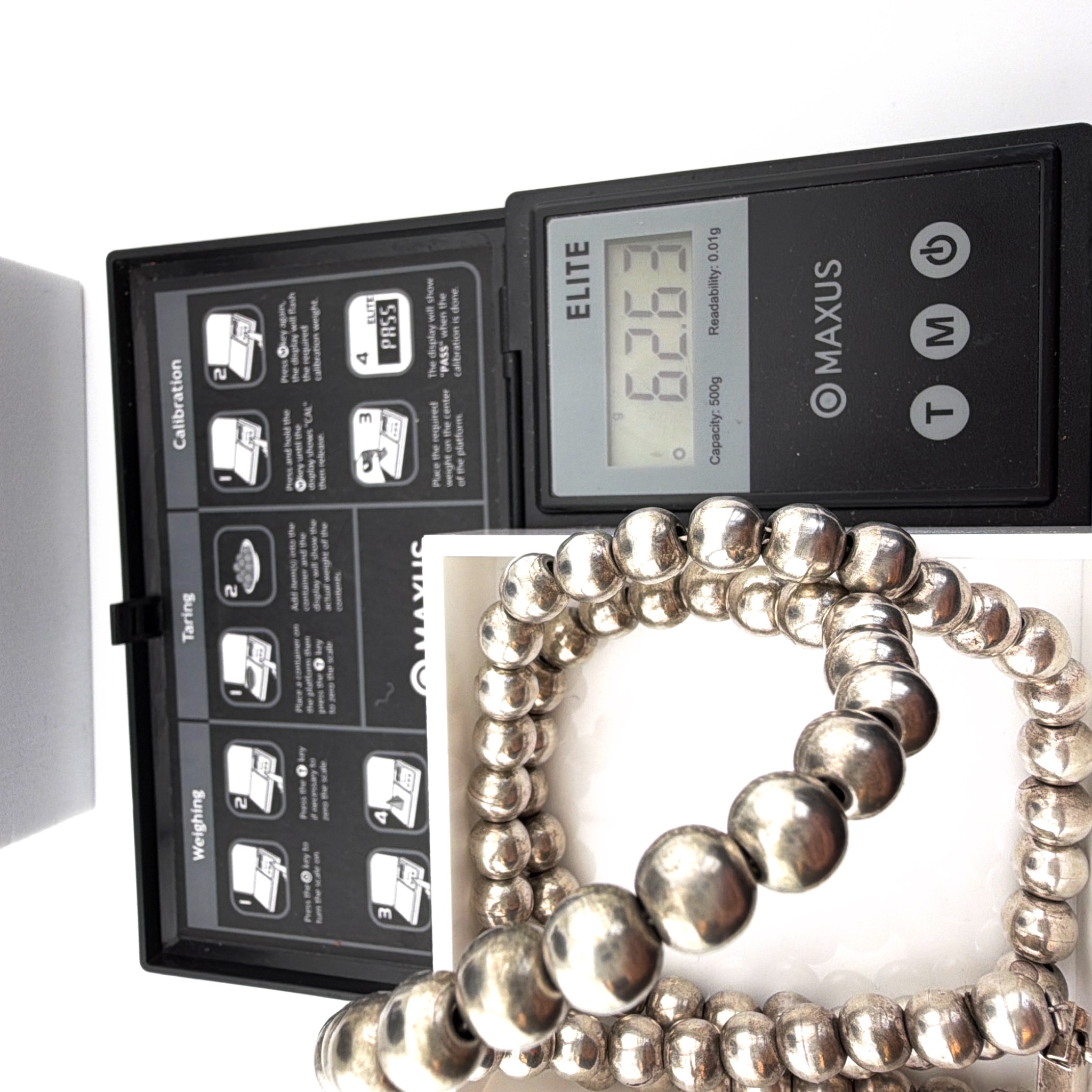 70s–90s 23.5 in Mexico Sterling Silver Graduated Bead Necklace 62.63g — For scale