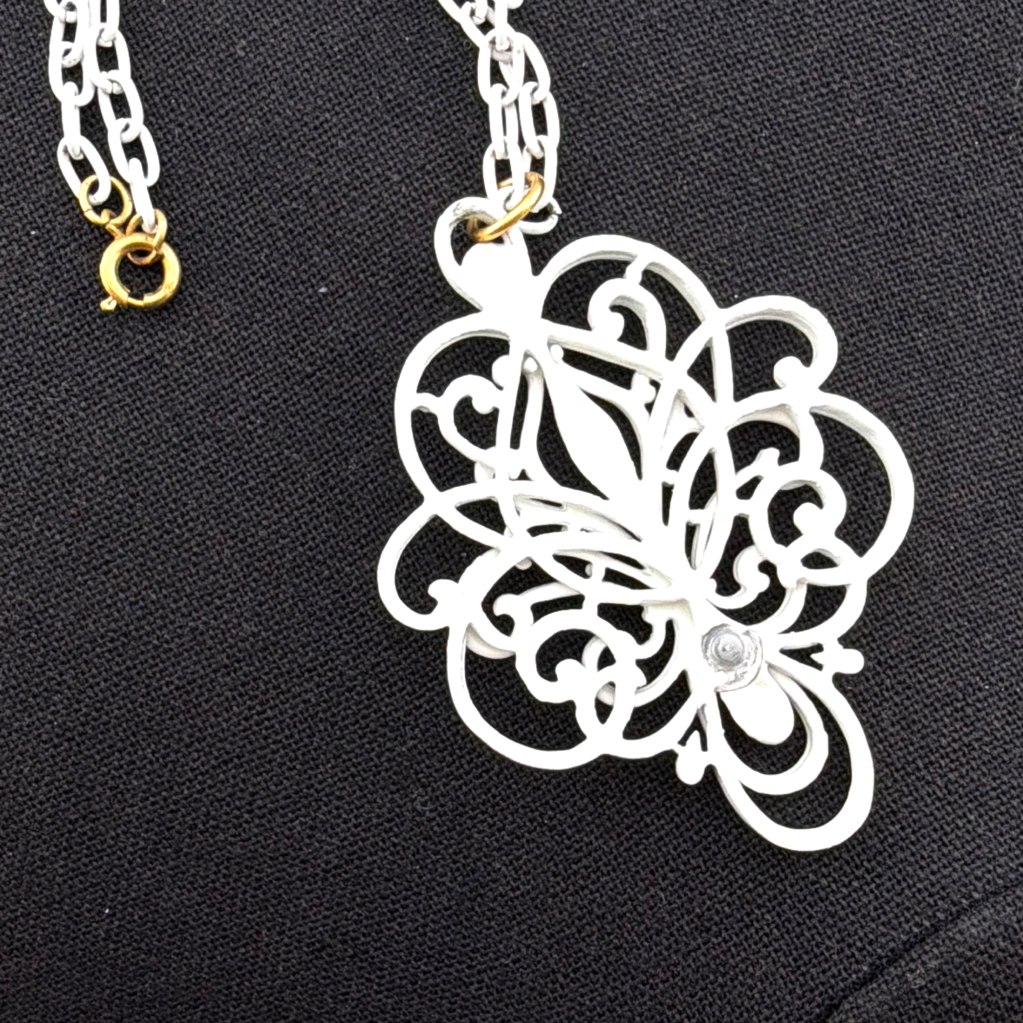 70s White Openwork Scroll Medallion Pendant Necklace — Front