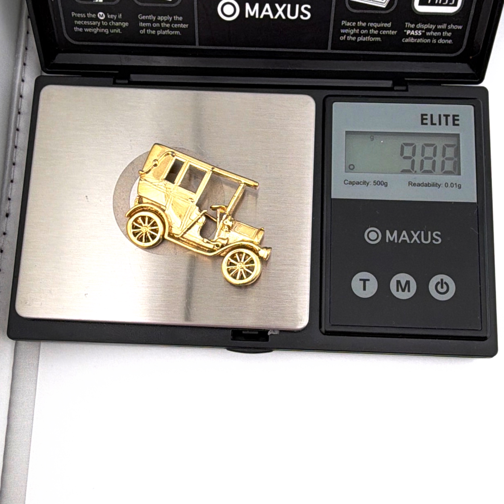 Mid-Century 50s–60s Trifari Gold Tone Antique Car Brooch 9.88g — For scale