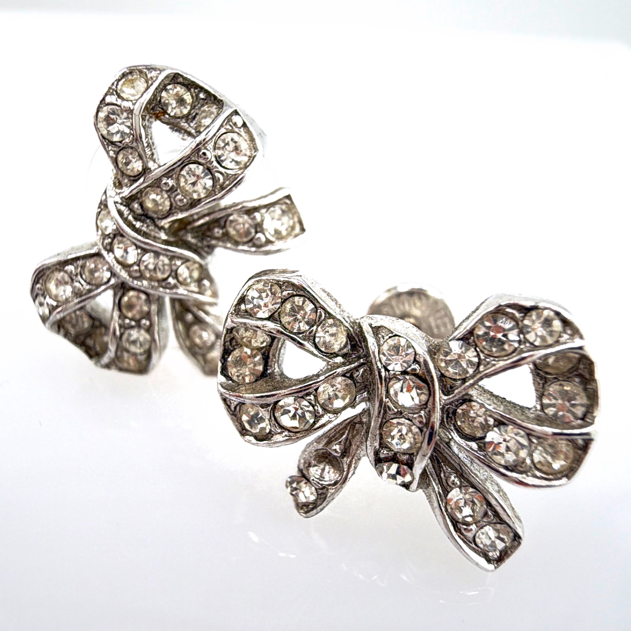 Vintage Monet Silver Tone Rhinestone Bow Earrings 5.00g — Front