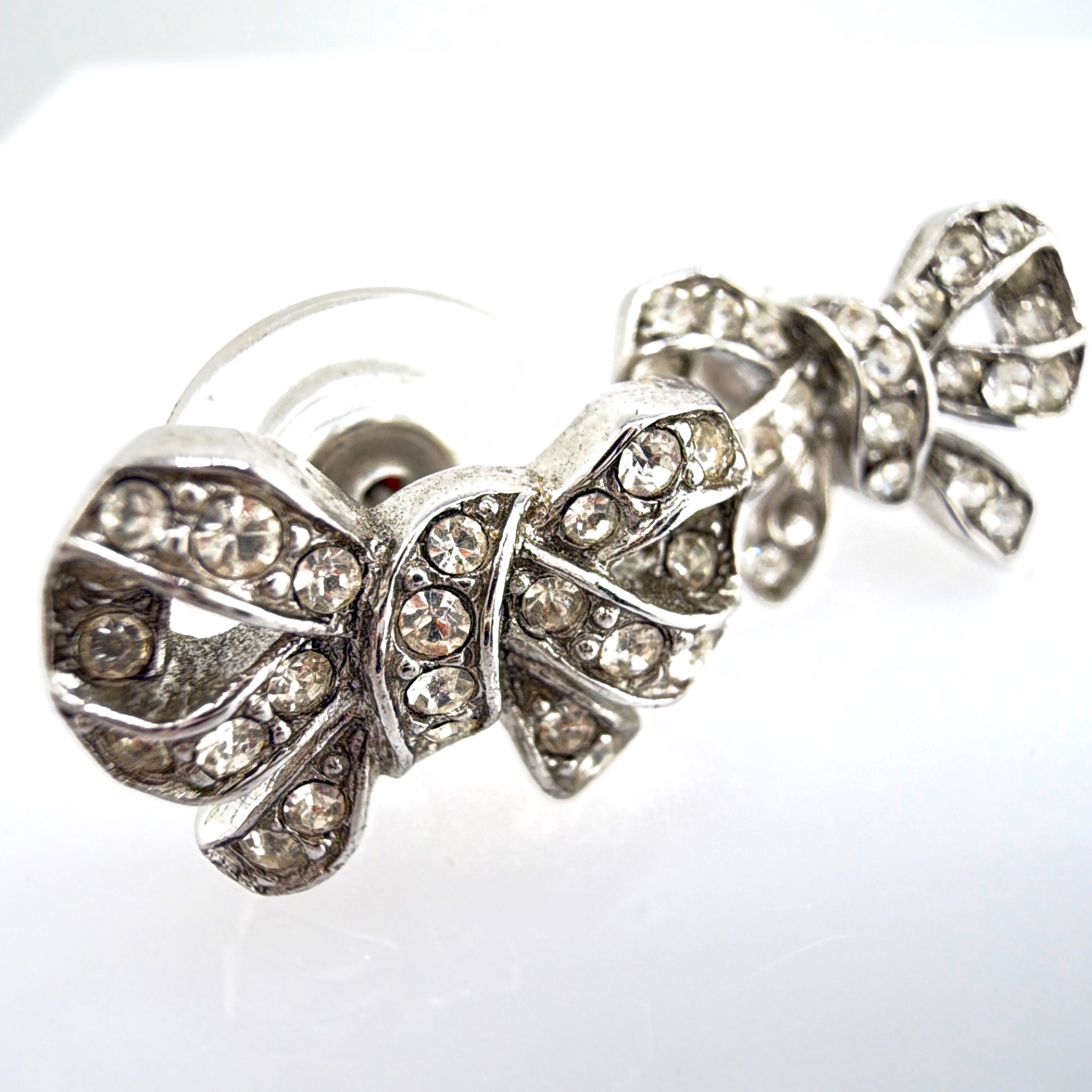 Vintage Monet Silver Tone Rhinestone Bow Earrings 5.00g — Front